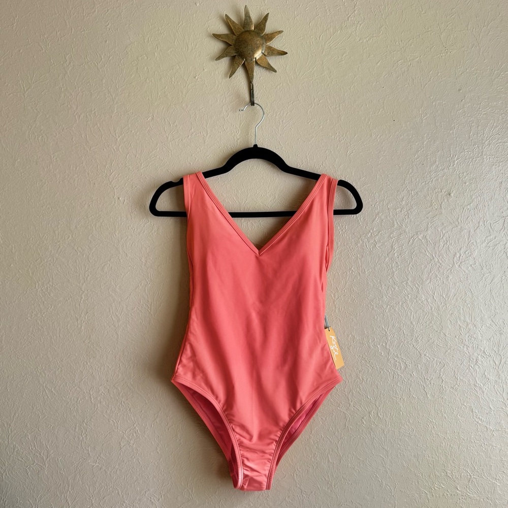 Never worn Woman’s Kona Sol Coral One Piece V Neck High Leg Low Back Swimsuit